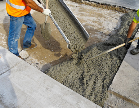 Quality assurance Workers mixing concrete