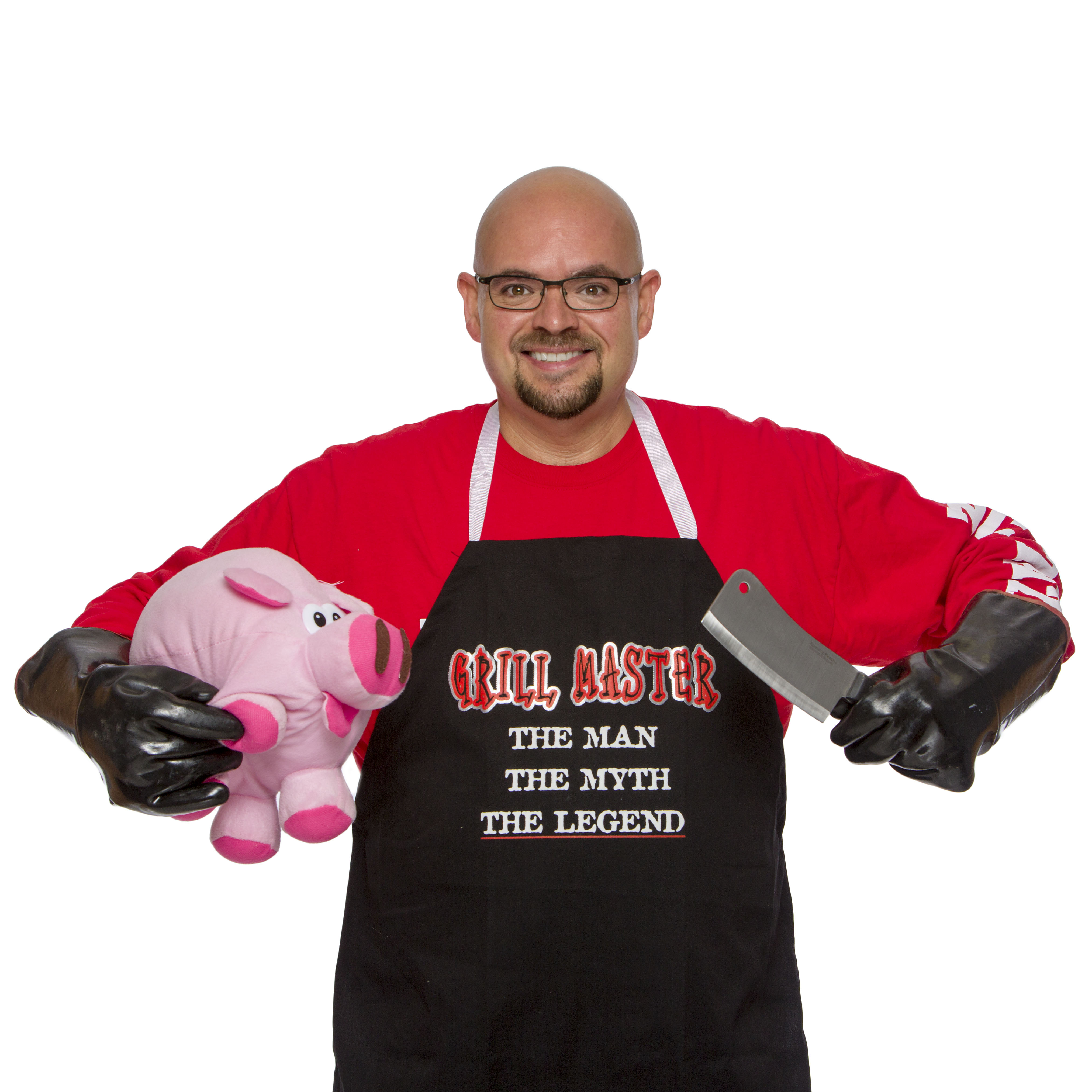 Chris Norville BBQ Chris Norville poses with a stuffed animal (pig) and a meat cleaver.