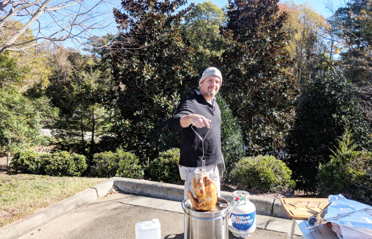 Christopher Burkhardt prepares the turkey for our Thanksgiving Feast.