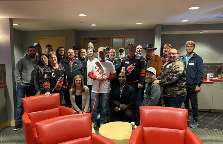 Falcon Staff enjoying time together at a Hurricane's Game.