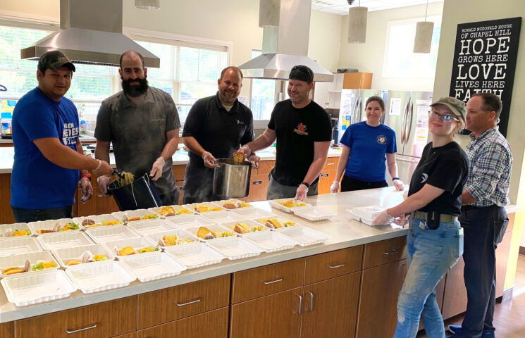 Falcon staff serve a meal to those staying at the Ronald McDonald House of Chapel Hill, supporting parents and loved ones who have a child going through an illness and/or treatment at nearby healthcare facilities.