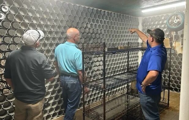A Falcon engineer explains our curing room to visitors, located in our in-house AASHTO accredited laboratory.